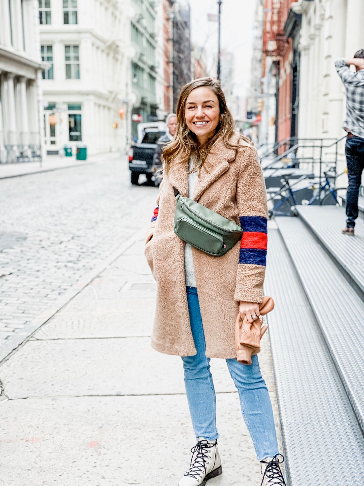 Woman wearing stylish diaper bag that doesn't look like a diaper bag