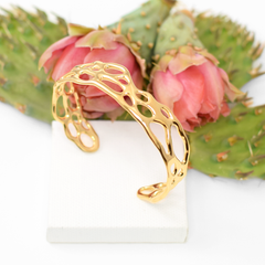 image of gold botanical cuff bracelet with prickly pear cactus on white