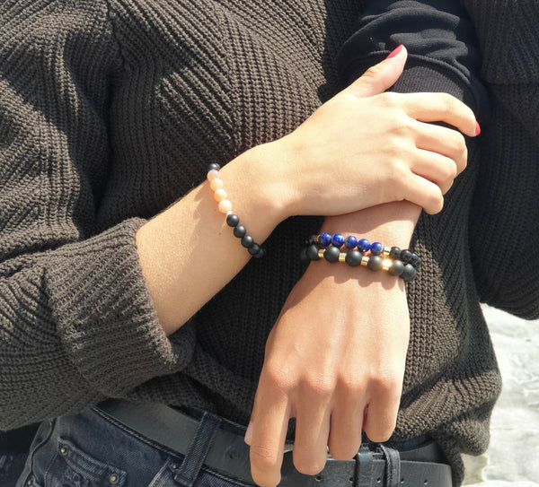 A couple wearing Samayla gemstone bracelets