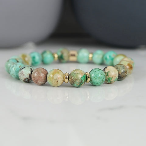 Chrysocolla gemstone bracelet with gold accessories