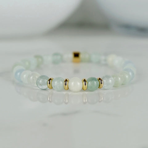 Aqumarine bracelet in 6mm beads with gold accessories