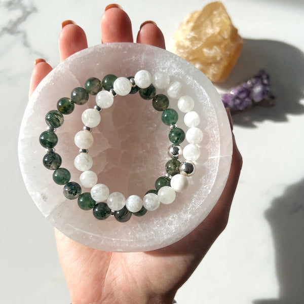 Two crystal bracelets in a selenite bowl