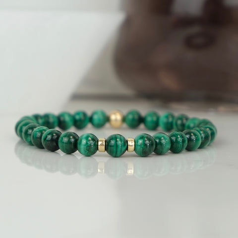 Malachite bracelet with gold accessories
