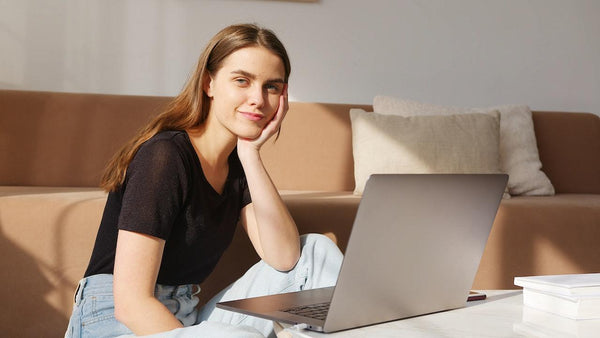 A woman free of pain sitting down on her living room floor