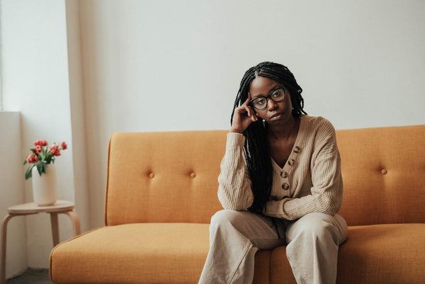 A pensive woman staring at the camera