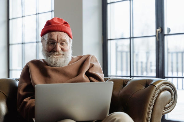 a senior using a laptop to search more information about CBD