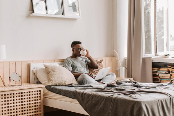 a man drinking a cup of CBD infused tea