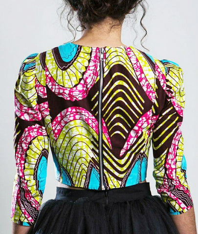 Picture of the back of a woman's top on a model, with an exposed zipper