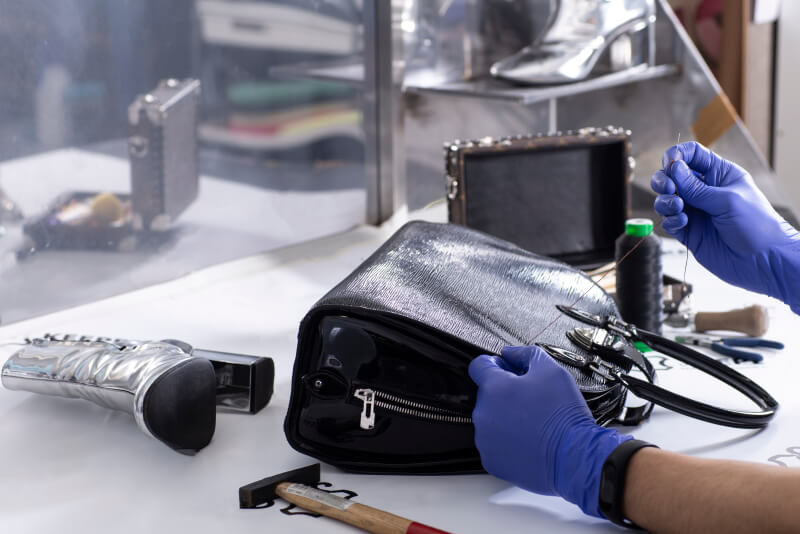 The master repair a leather women's handbag