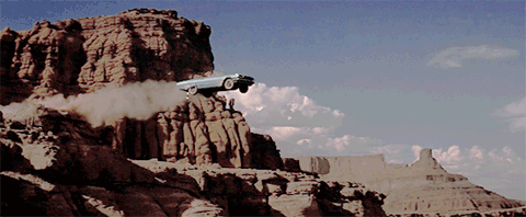 GIF of car driving off of cliff