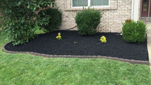 Rubber mulch in front landscape planting beds