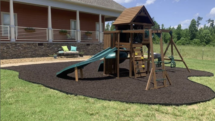 Brown rubber mulch with black landscape border edging