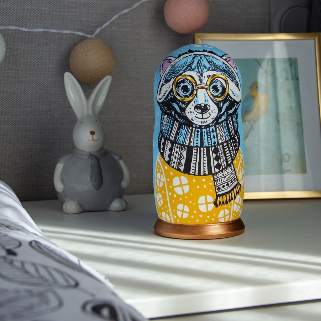 The ambient blue and yellow color combinations of our Raccoon nesting dolls make them a lovely addition to every kid's bedroom.