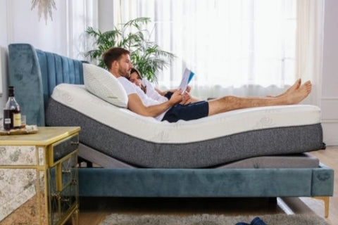 couple laying on adjustable bed
