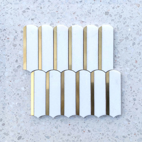 white natural stone mosaic tiles with gold lining.