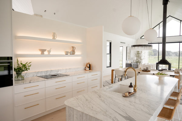 modern kitchen design with white marble and white splashback