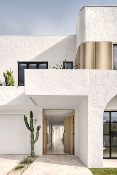 Mediterranean inspired home façade with creamy white colour curvy architecture