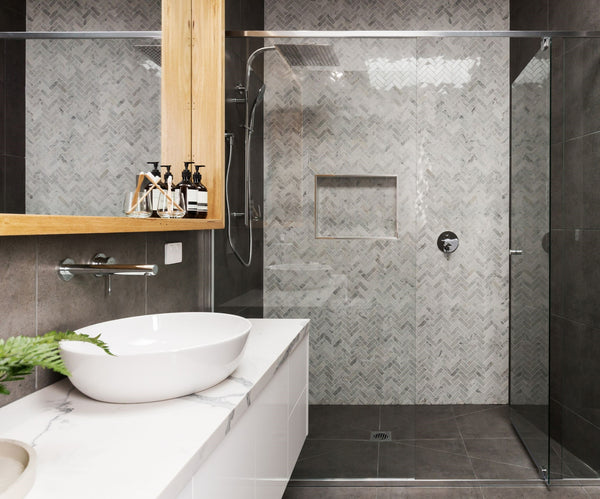 bathroom with black and grey tiles