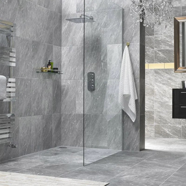 bathroom with floor-to-ceiling grey natural stone tiles.