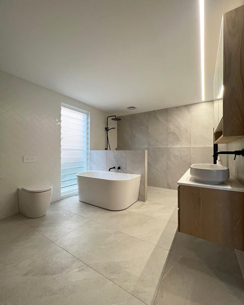 a floor-to-ceiling bathroom with grey porcelain tiles