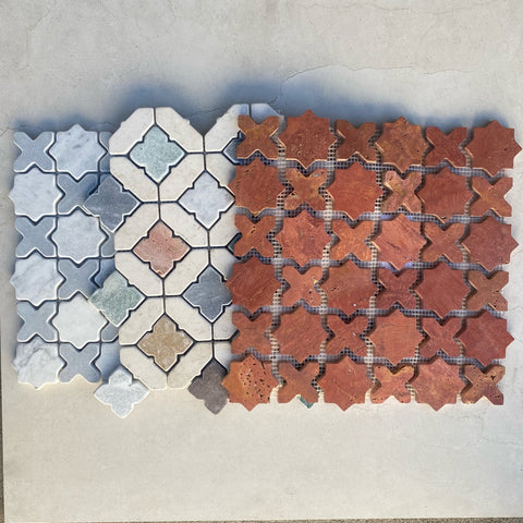 flat lay image of three stone mosaic tiles 
