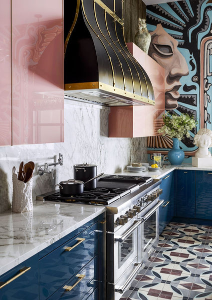 mixed style kitchen design with marble slab splashback and stone mosaic flooring, as well as art painted on one ofo the walls