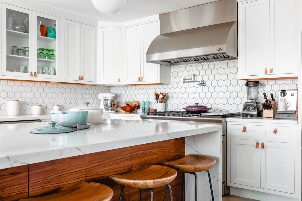 kitchen with white and brown colour palette and hexagon splashback