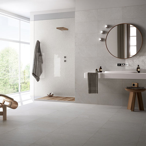 A bathroom with grey porcelain tiles flooring and walls.