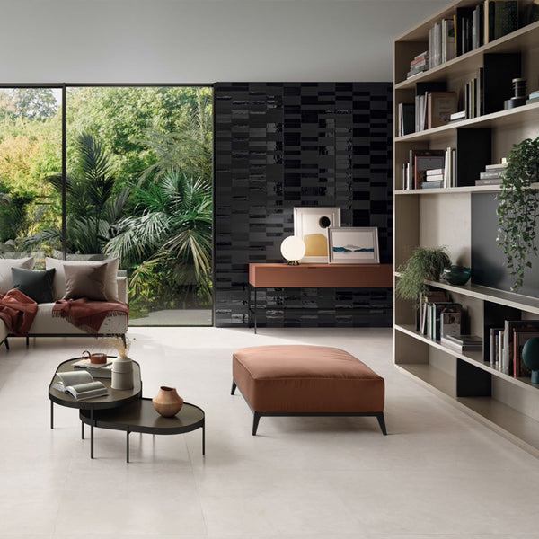 a study room with beige tiles flooring and black subway tiles on a feature wall. 