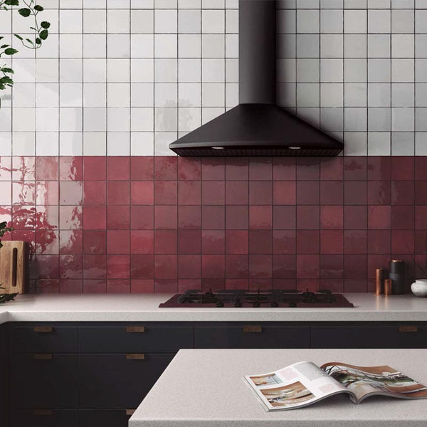 a kitchen splashback with red an white Moroccan porcelain tiles