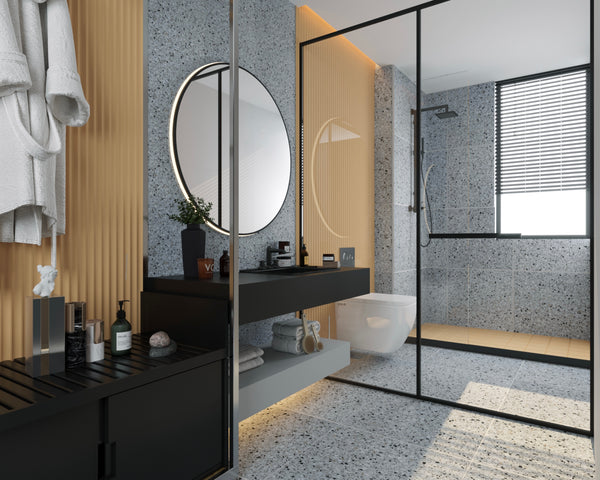 a bathroom with grey terrazzo tiles flooring and wall tiles and yellow tiles complementing the design.