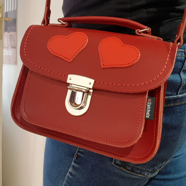 person wearing heart motif luna bag