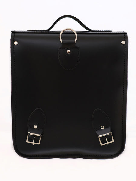 back of black leather satchel backpack showing silver nickel detailing
