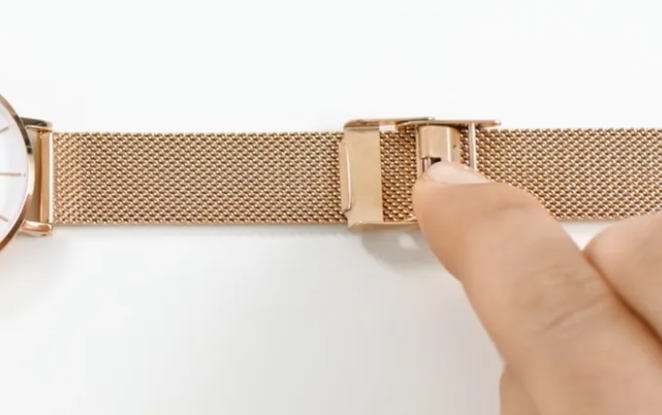 women adjusting watch strap
