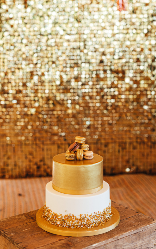 Gold and Ivory Wedding Cake with Macarons - Tipi Wedding Inspiration