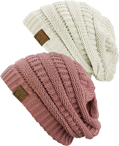 Two knit hats in pink and cream colors