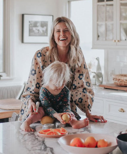 Sarah Wright Olsen smiling with son