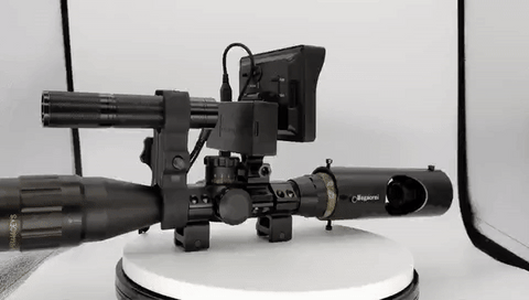 An infrared optics hunting scope with a digital screen displaying a wolf, indicating its use for nighttime wildlife observation.