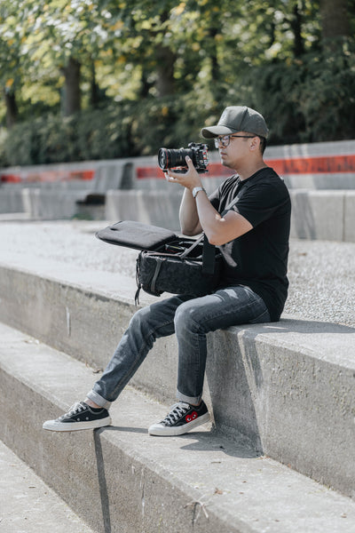 photographer takes photo with camera