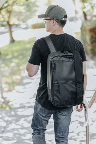 Image is of photographer wearing top shelf camera bag