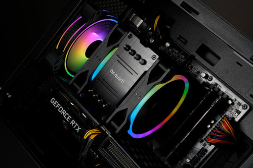 A Be Quiet! CPU cooler installed inside a Utopia Helix Gaming PC. The CPU Cooler has twin RGB Fans matching the RGB Fans fitted to the PC Case.