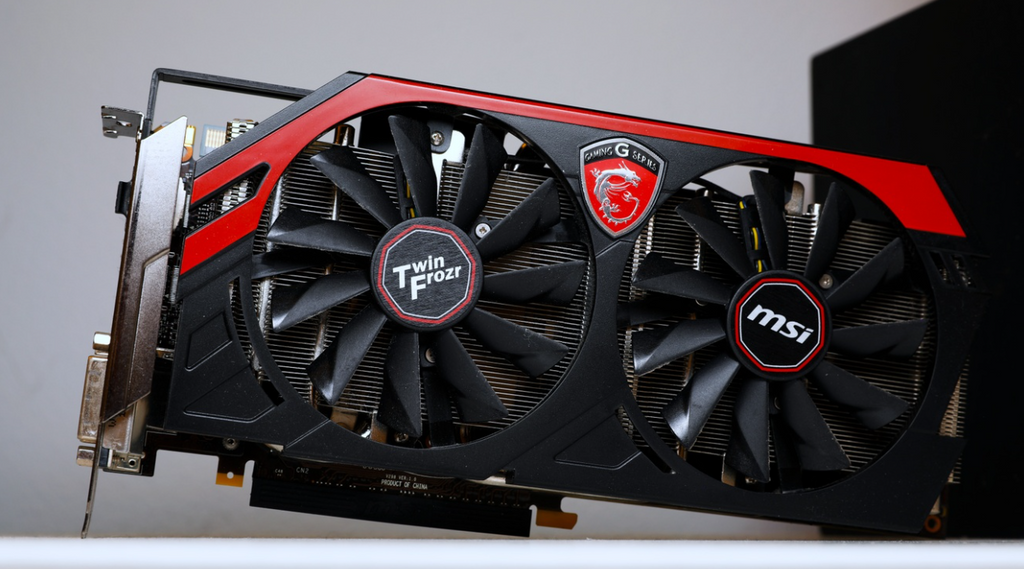 MSI Twin Frozr graphics card with black and red fan shrouds placed on a desk