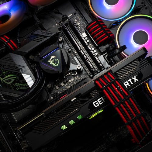 An ASUS motherboard with RGB fans and black & red cables