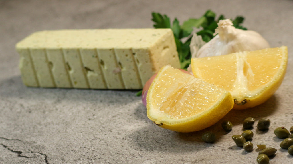 Lemon Caper Butter, Shallot, Parsley and garlic on slate background