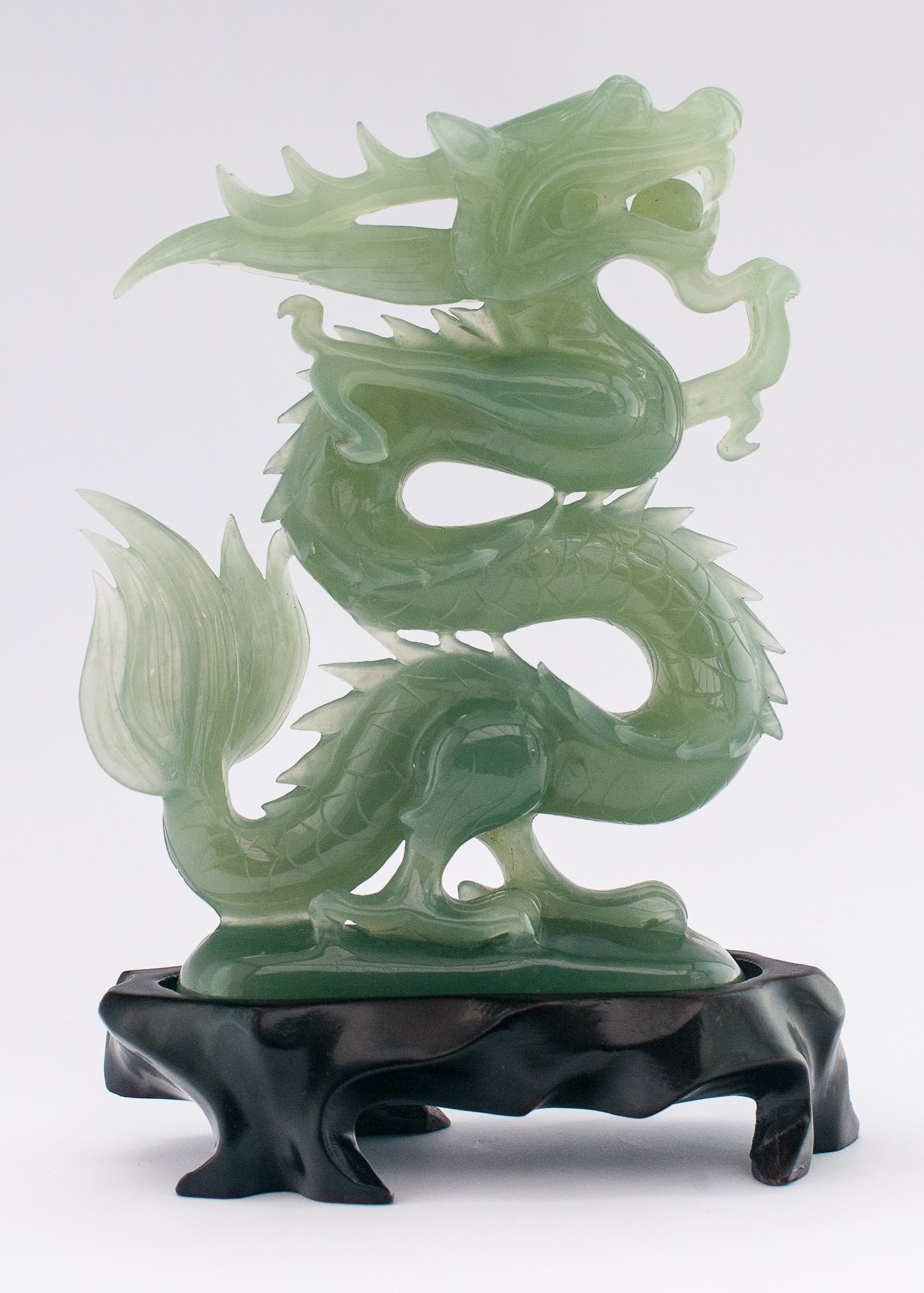 A superb carved green jade Dragon with loose carved ball in its mouth ...