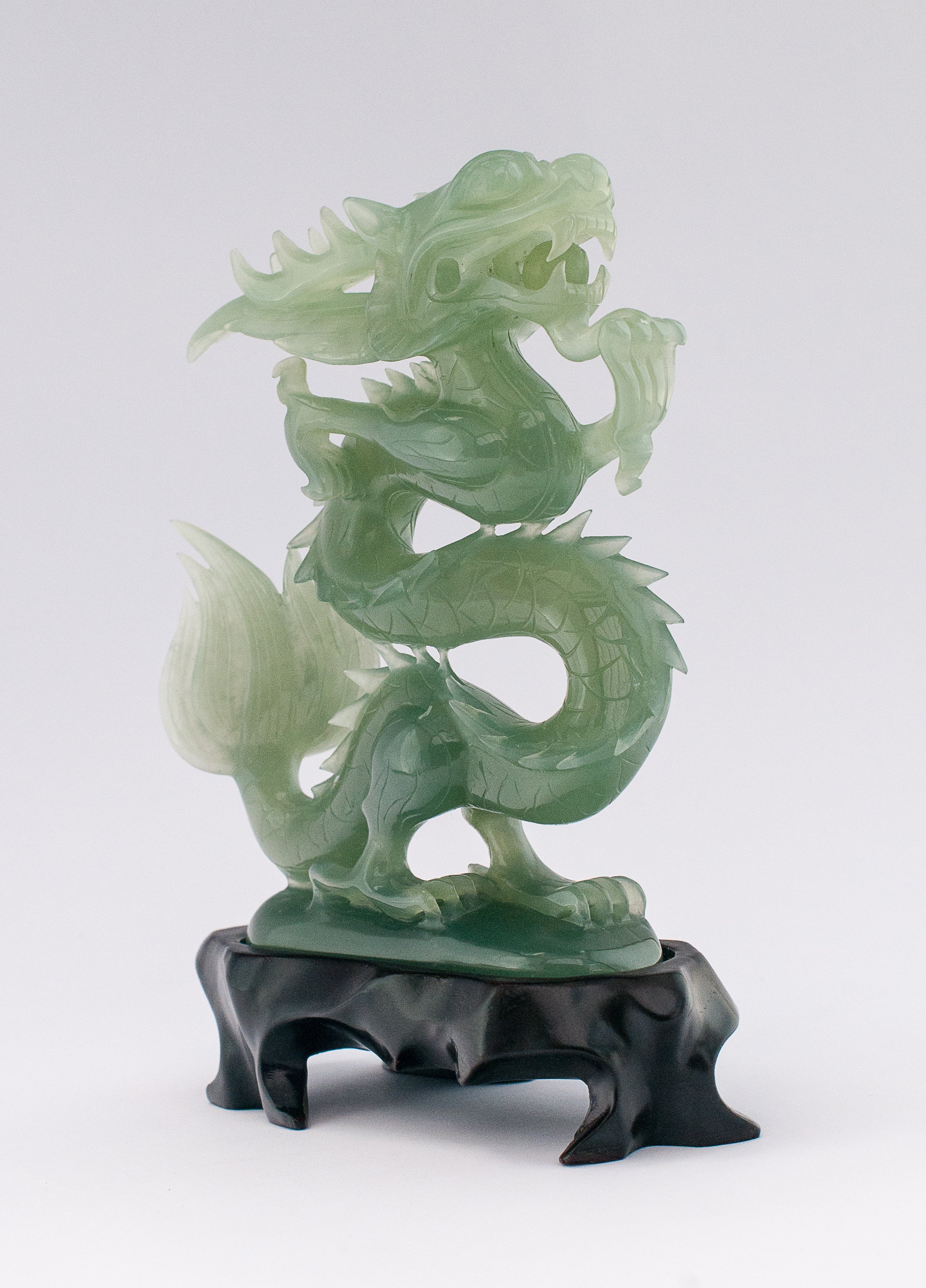 A superb carved green jade Dragon with loose carved ball in its mouth ...