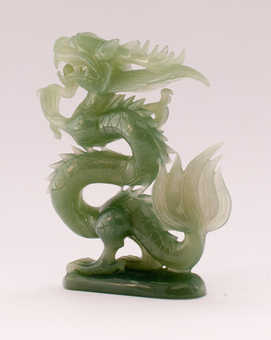 A superb carved green jade Dragon with loose carved ball in its mouth ...