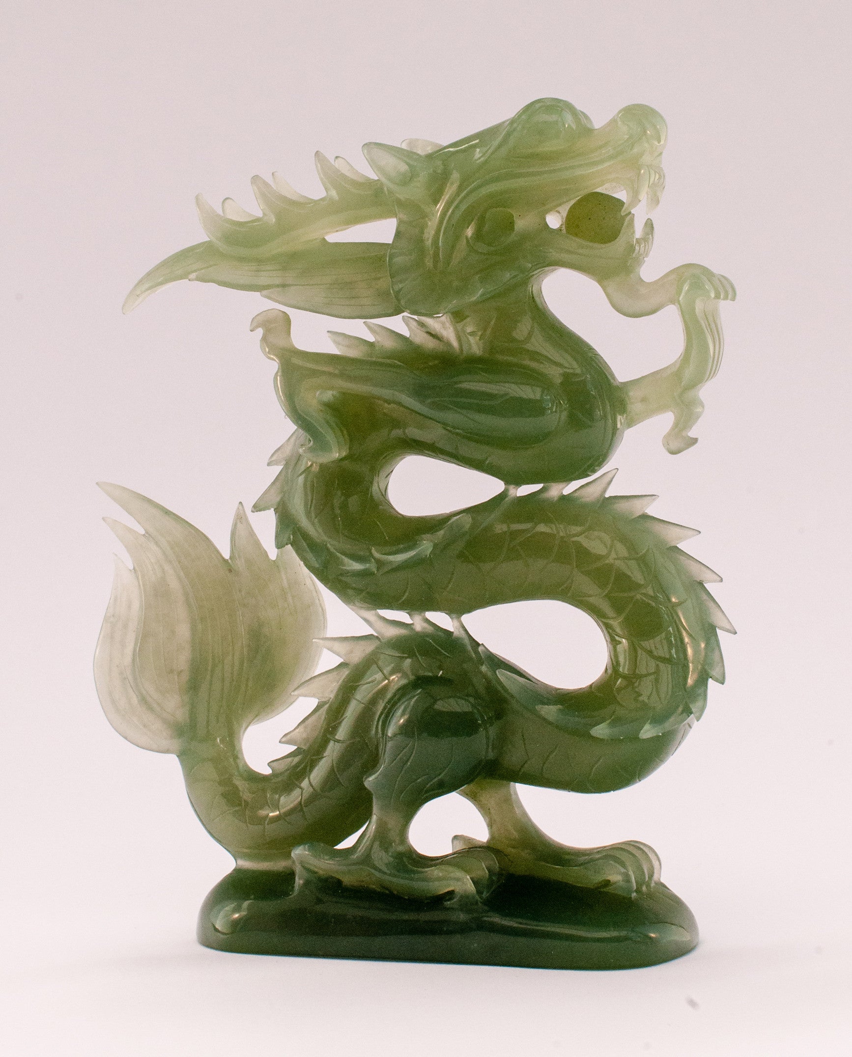 A superb carved green jade Dragon with loose carved ball in its mouth ...