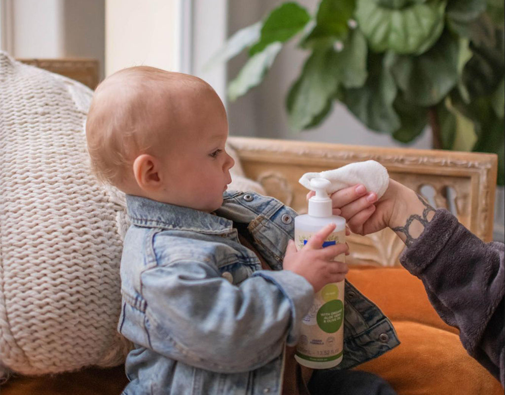 baby using Mustela skin care products