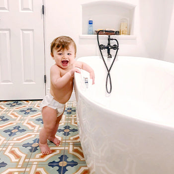 1 year old baby getting ready for a bath